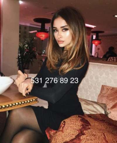 Mersin Mezitli'den Etkileyici ve Sakin Görünümüyle Büyüleyen Escort Bayan: Kızıl Saçlı, Fi