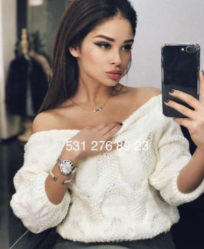 Mersin Mezitli'den Etkileyici ve Sakin Görünümüyle Büyüleyen Escort Bayan: Kızıl Saçlı, Fi